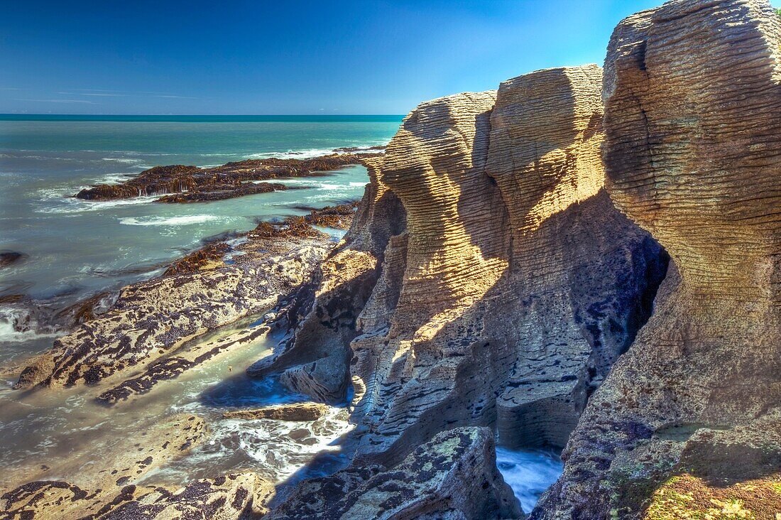 Pancake rocks, stacked limestone layers near Dolomite Point, Punakaiki, Paparoa National Park, West Coast, New Zealand