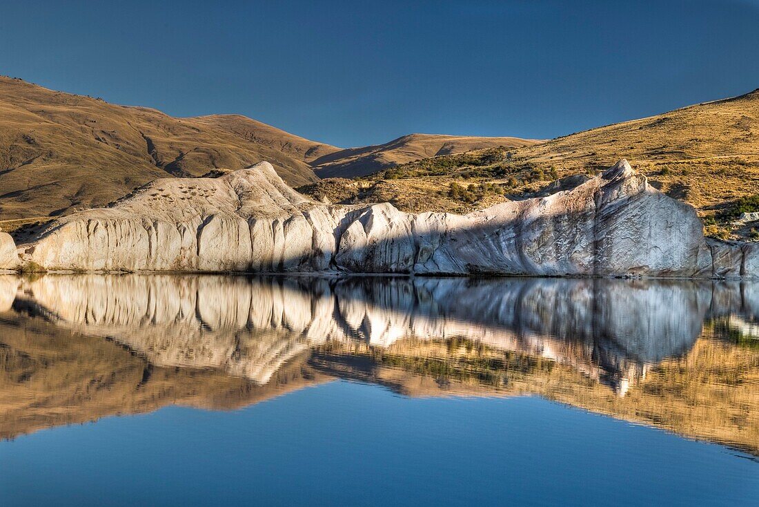 Blue Lake reflection at dawn, autumn, St Bathan´s, Central Otago, New Zealand