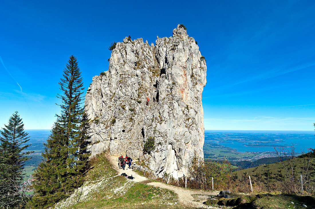 Mountaineers at Staffelstein, Kampenwand, lake Chiemsee in background, Chiemgau, Upper Bavaria, Germany