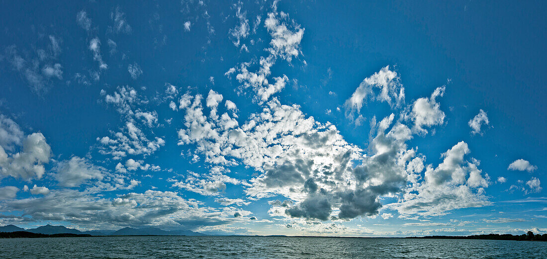 Mood of clouds above lake Chiemsee, Chieming, Chiemgau, Upper Bavaria, Germany