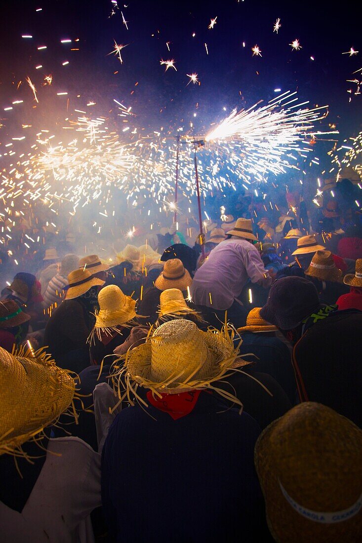 Correfoc  Catalan traditional festival 16th August where people dressed as devils light fireworks while dancing in the street, La Bisbal d Emporda, Baix Emporda, Costa Brava, Girona province, Catalonia, Spain
