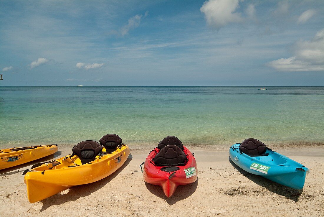 Sea Kayaks on beach in Roatan Island, Honduras.