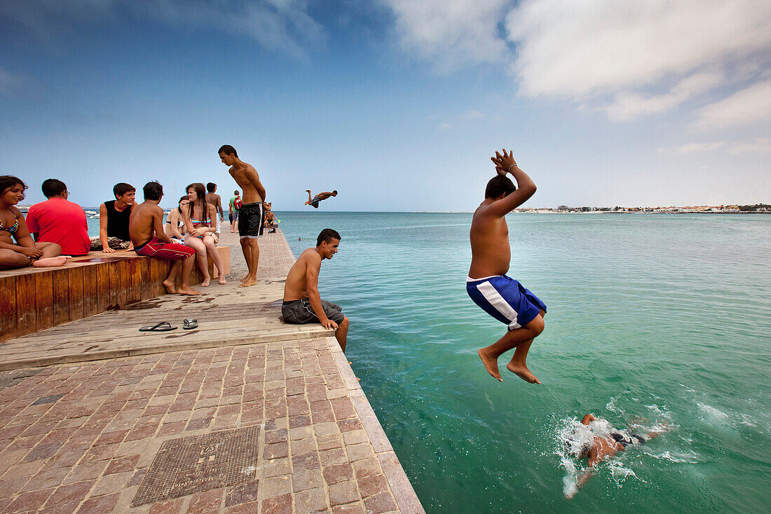Boys jumping in the water, Corralejo, Fuerteventura, Canary Islands, Spain