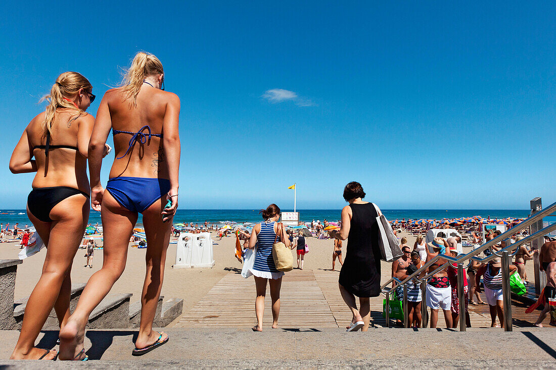 Young women on the beach, Playa del Ingles, Gran Canaria, Canary Islands, Spain