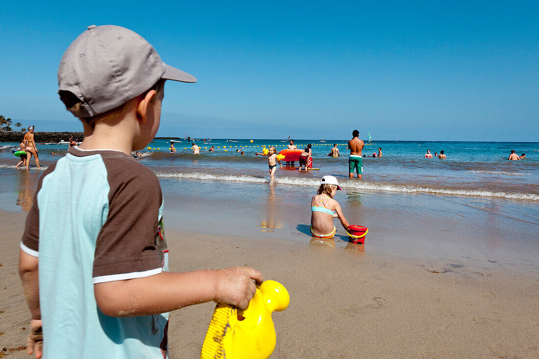 Boy on the beach, Playa de Cucharas, Costa Teguise, Lanzarote, Canary Islands, Spain, Europe