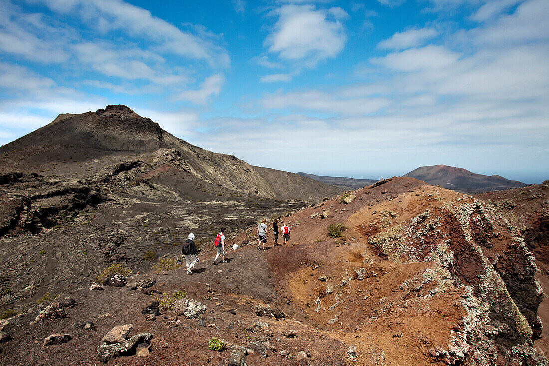 Volcan trekking on Pico Partido, Timanfaya National Park, Lanzarote, Canary Islands, Spain, Europe