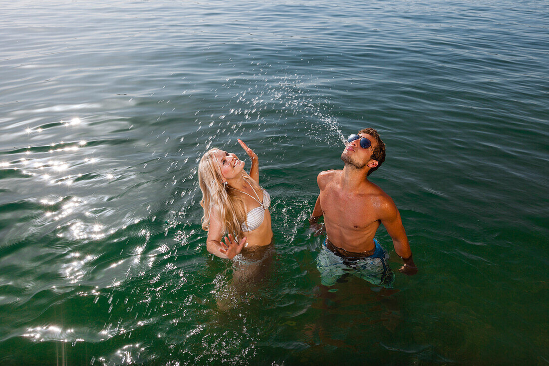 Young couple bathing in Lake Starnberg, Bavaria, Germany