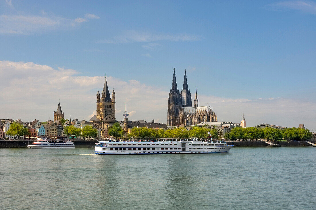 View at the Cologne Cathedral with Rhine and a tourist boat, Cologne, North Rhine Westphalia, Germany