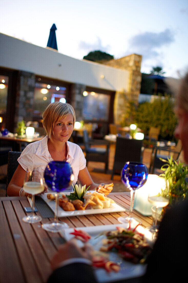 Couple having dinner at restaurant Ariadne, Elounda Beach Resort, Elounda, Crete, Greece