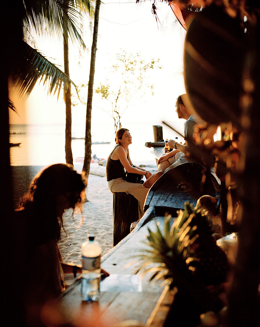 Tourists at Cholo`s Beach Bar, beach on the westside, Nungwi, Zanzibar, Tanzania, East Africa