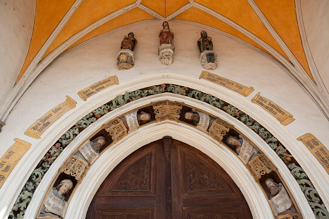 Figurative decoration on the portal of the church of St. Joduk, Landshut, Lower Bavaria, Bavaria, Germany, Europe
