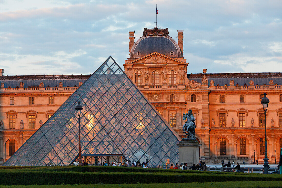 Louvre and the pyramid by I.M. Pei in the evening light, Paris, France, Europe