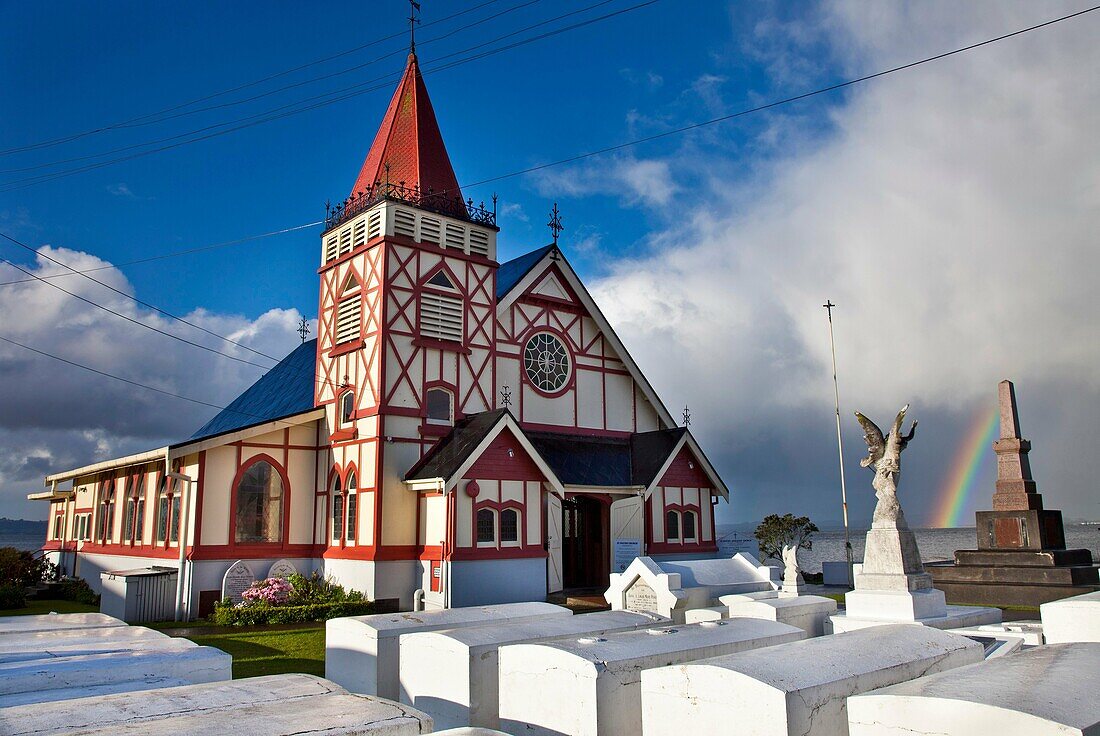 Rainbow over Maori owned Church of St Faith, Ohinemutu, Rotorua.