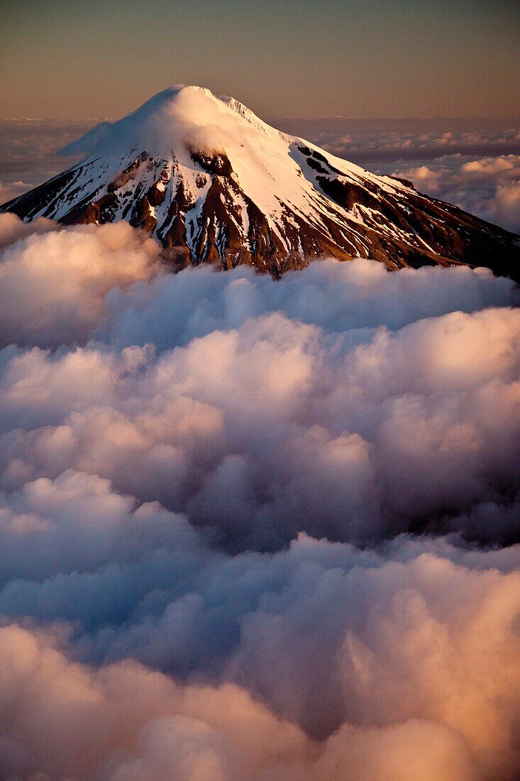 Mt Egmont / Taranaki, western flanks of dormant volcano above evening cloud, sunset, Taranaki