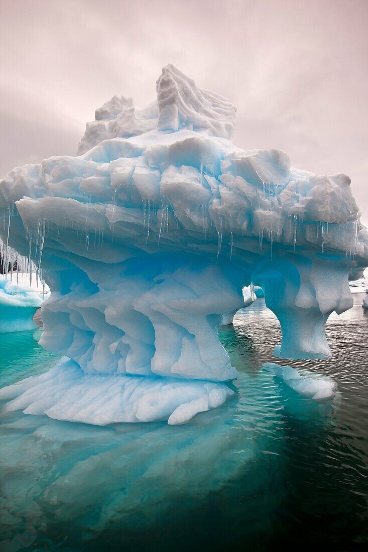 Eroded iceberg with icicles, Pleneau Island, Antarctic Peninsula.