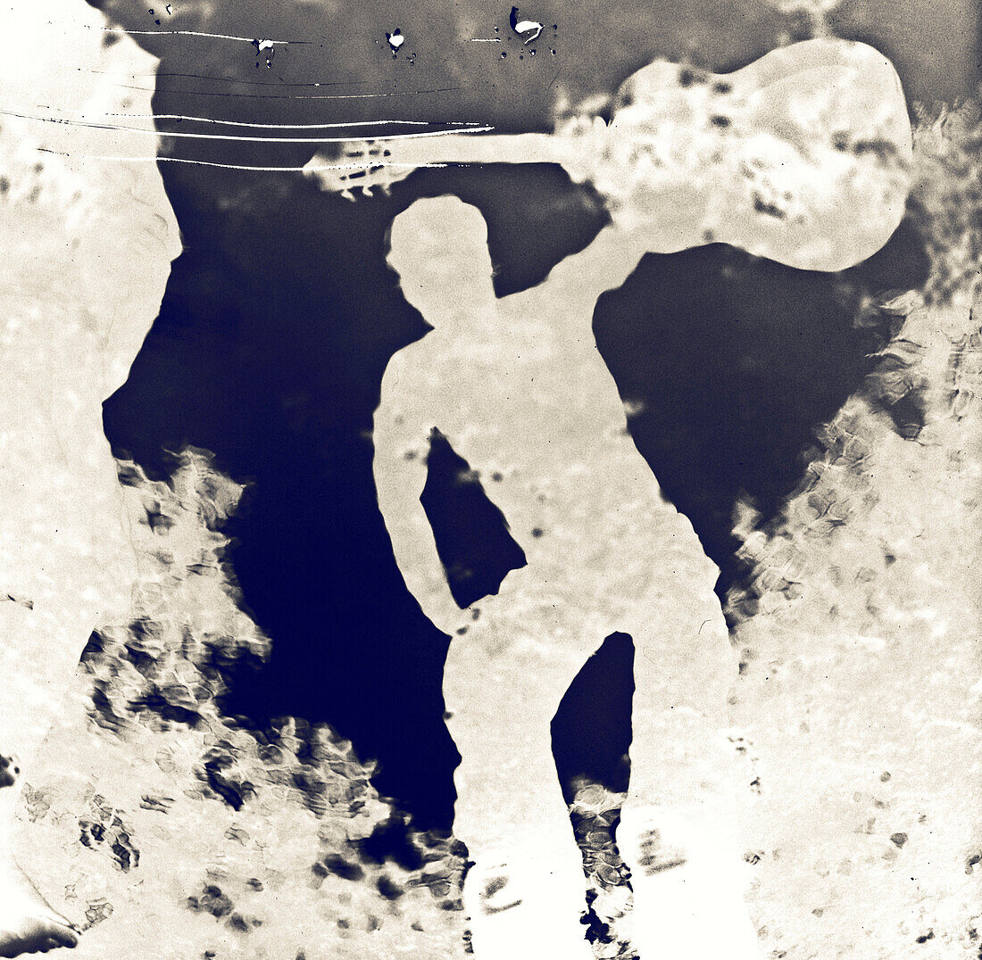 Negative Reflection of Man With Guitar