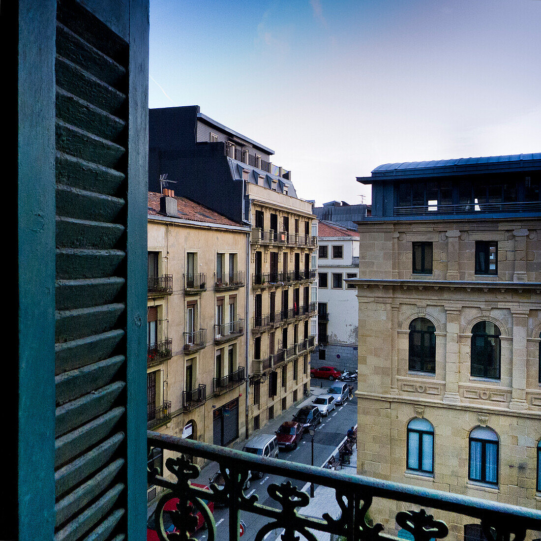 Urban Street Scene Viewed Through Apartment Window, San Sebastian, Spain