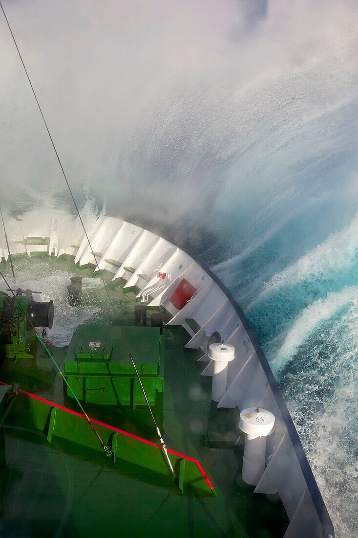 Wave crashes over ship´s bow, Drake Passage near Antarctic Peninsula.