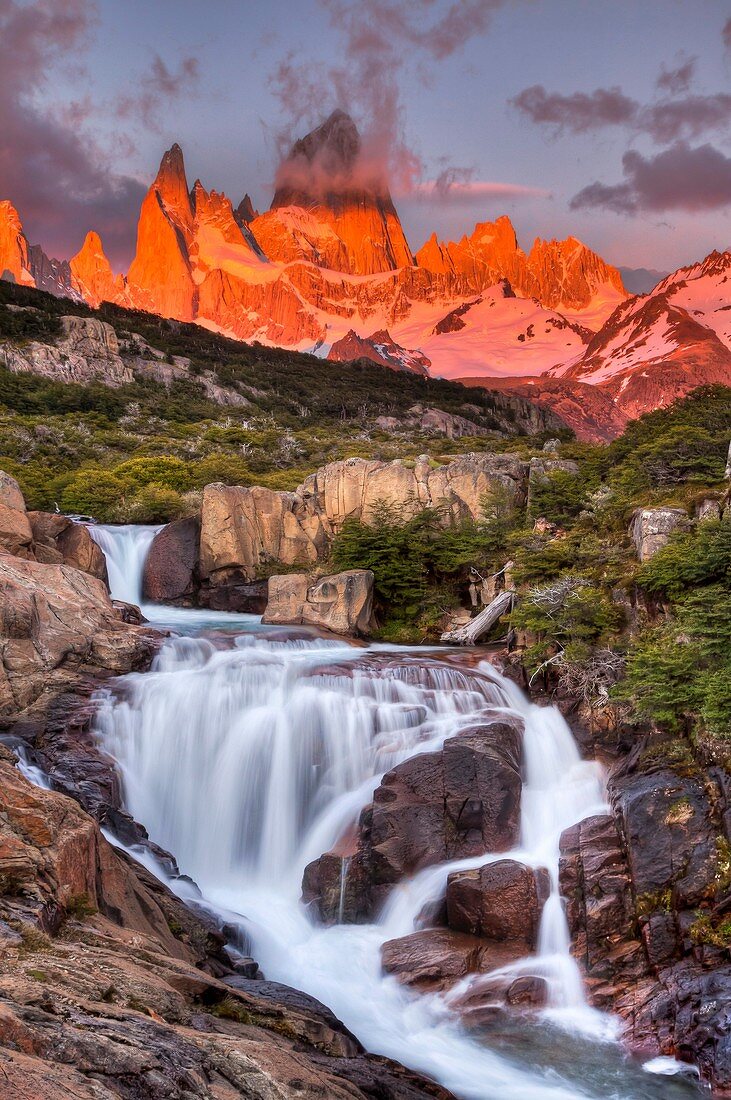 FitzRoy waterfall at dawn under famous rock peak Cerro FitzRoy  El Chalten, Parque Nacional Los Glaciares, Patagonia, Argentina