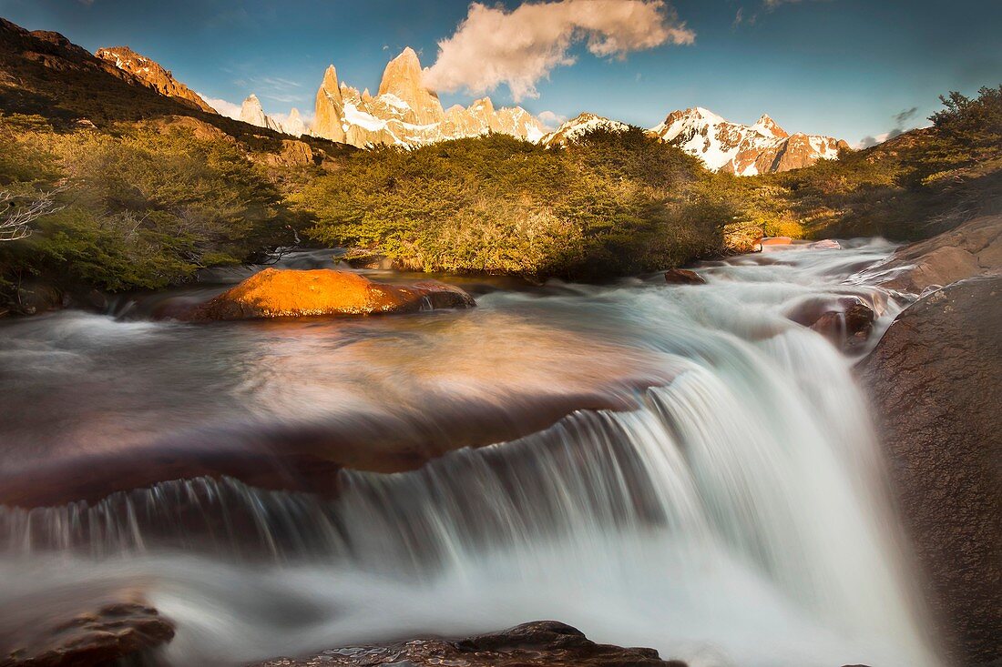 FitzRoy waterfall at dawn under famous rock peak Cerro FitzRoy  El Chalten, Parque Nacional Los Glaciares, Patagonia, Argentina