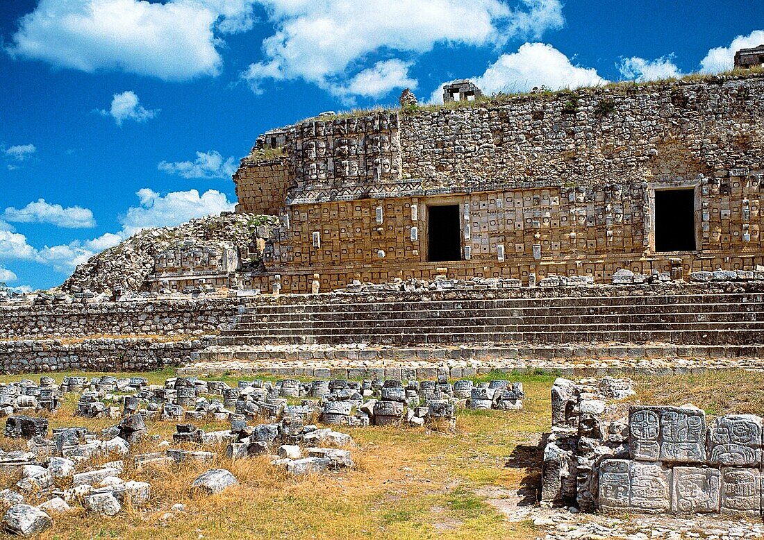 Though there are numerous representations of the rain god Chaac throughout Yucatán, nowhere are they as apparently obsessive as they are in the Codz Poop at Kabáh  One of the most prominent buildings at Kabáh is the Palace of the Masks  This large buildin