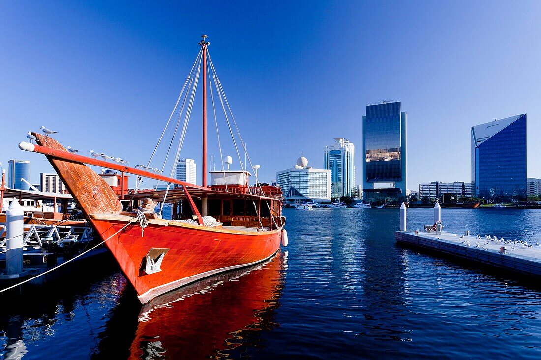 A wooden Dow sailing vessel docked in Dubai Creek, Dubai, UAE.