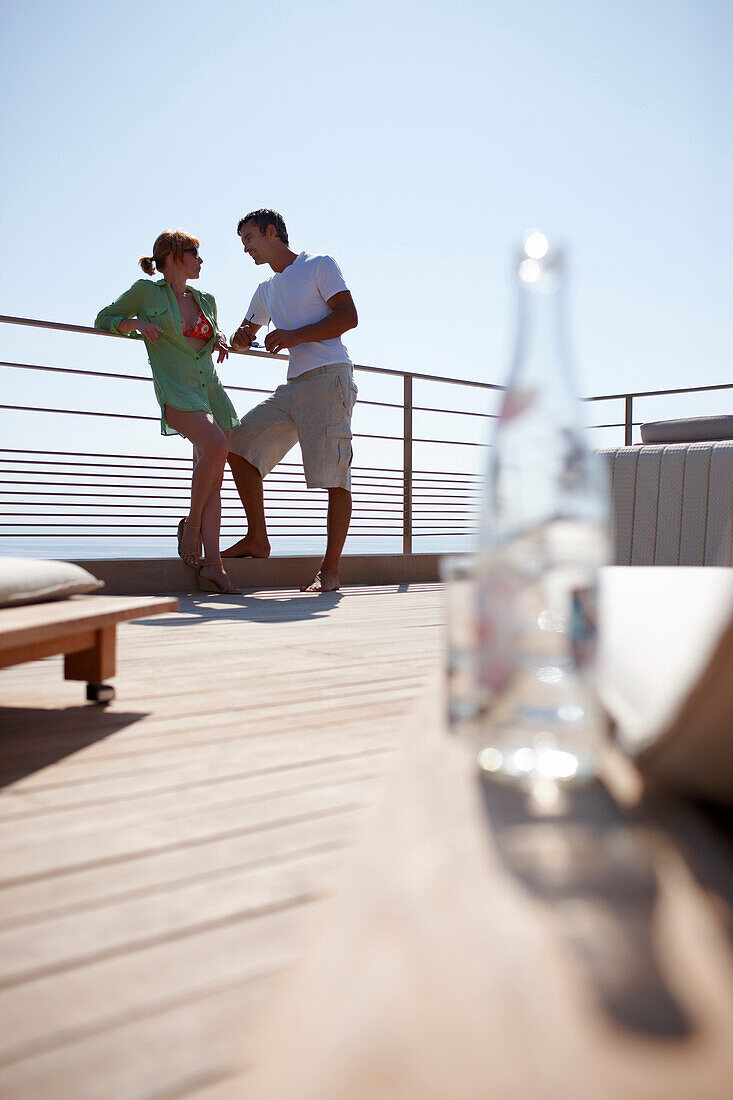 Couple standing on the suite terrace, Ramatuelle, Chemin de la Quessine, Ramatuelle, France