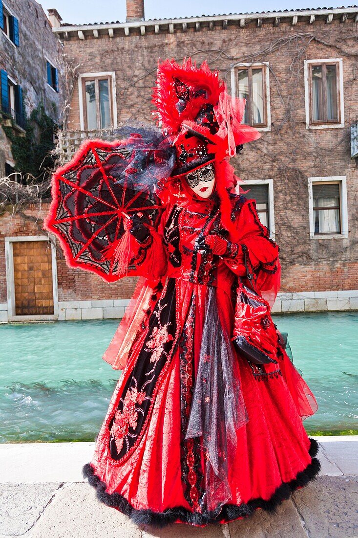 A masked woman at the carnival in Venice, Italy, Europe