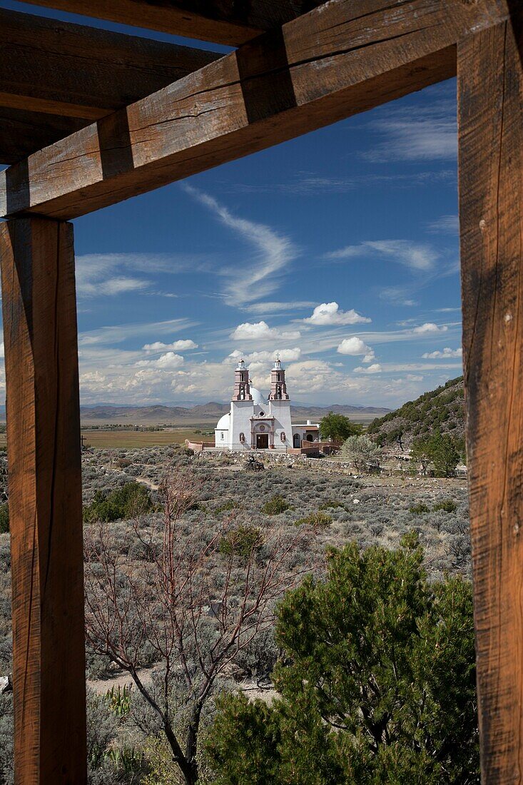 San Luis, Colorado - The Chapel of All Saints on a hill above town  The chapel is at the end of a trail with sculptures showing the Stations of the Cross