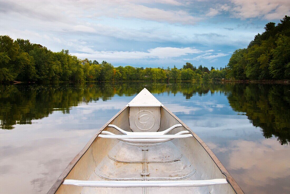 Canoe on the water of Stillwater River, Orono