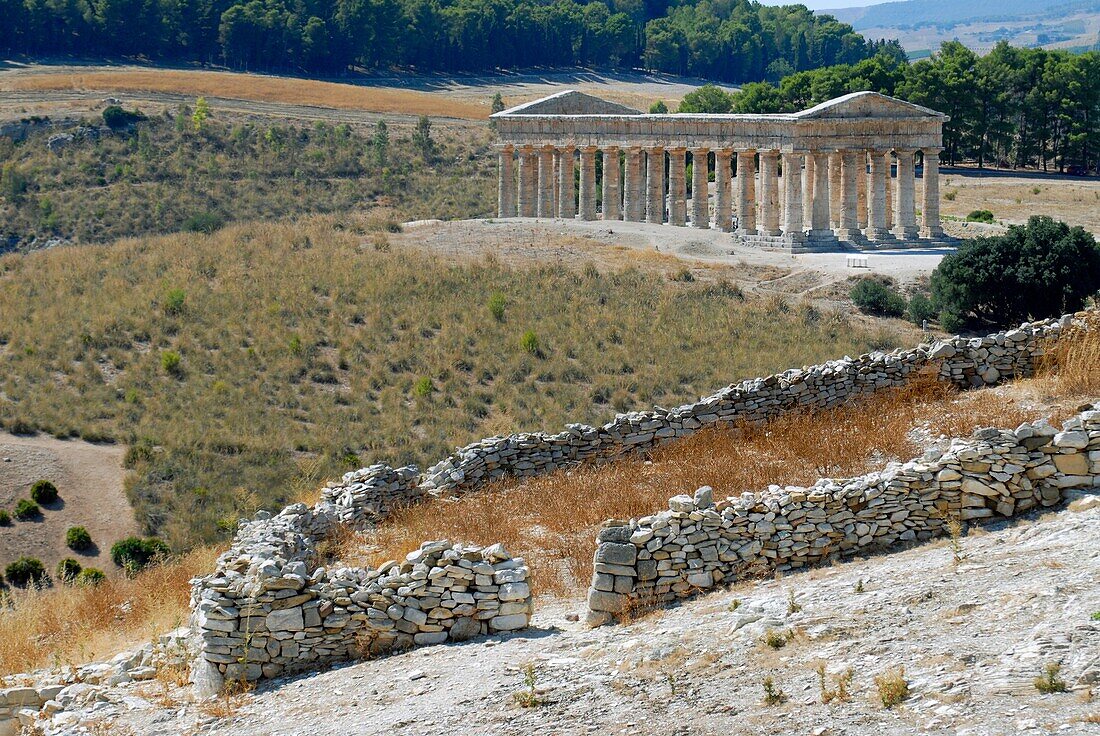 Full view of the Greek Doric temple from a distance Segesta Sicily Italy