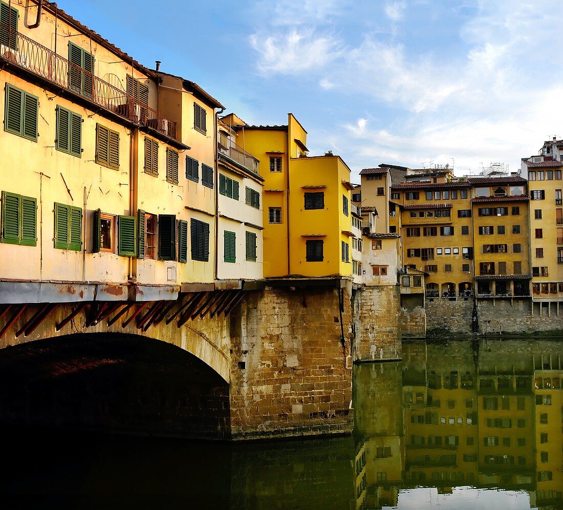 Pontevecchio bridge over the Arno river with details of the back of the shops held by wooden rafters Florence Italy