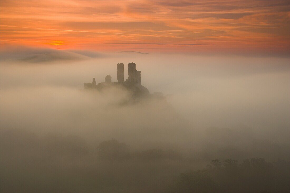 Corfe Castle in the mist at Dawn Purbeck Dorset