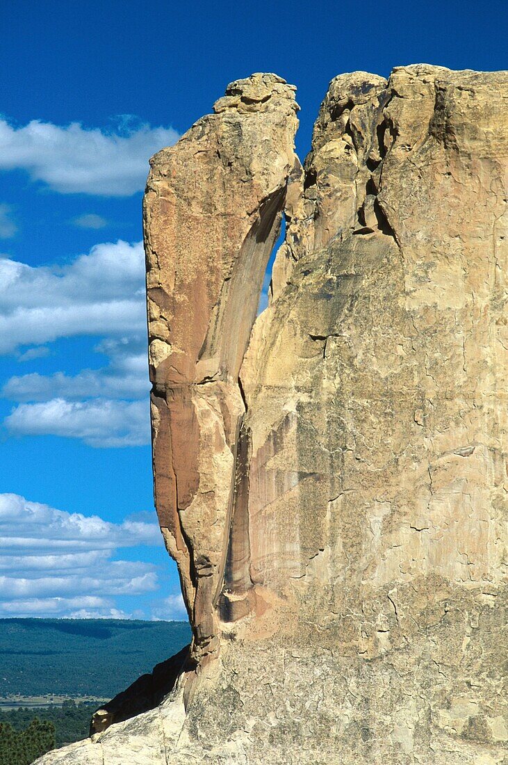 Sandstone cliff balances precariously at El Morro National Monument, New Mexico, USA