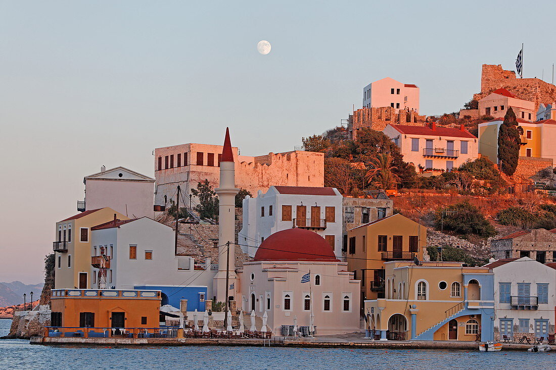 Faros-Coupa Bar, the mosque and the red castle at dusk, Kastelorizo Megiste, Dodecanese Islands, Greece, Europe