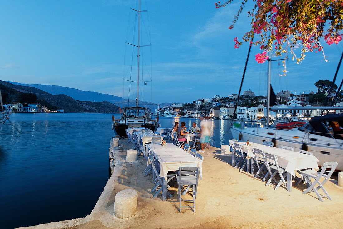 Lazarakis restaurant at harbour in the evening, Kastelorizo Megiste, Dodecanese Islands, Greece, Europe