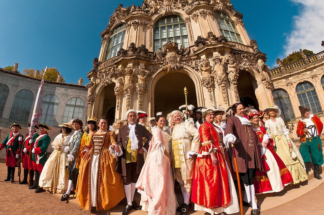 A procession of the Royal Court of August the Strong people in historical costume at the Dresden Zwinger, Dresden, Saxony, Germany