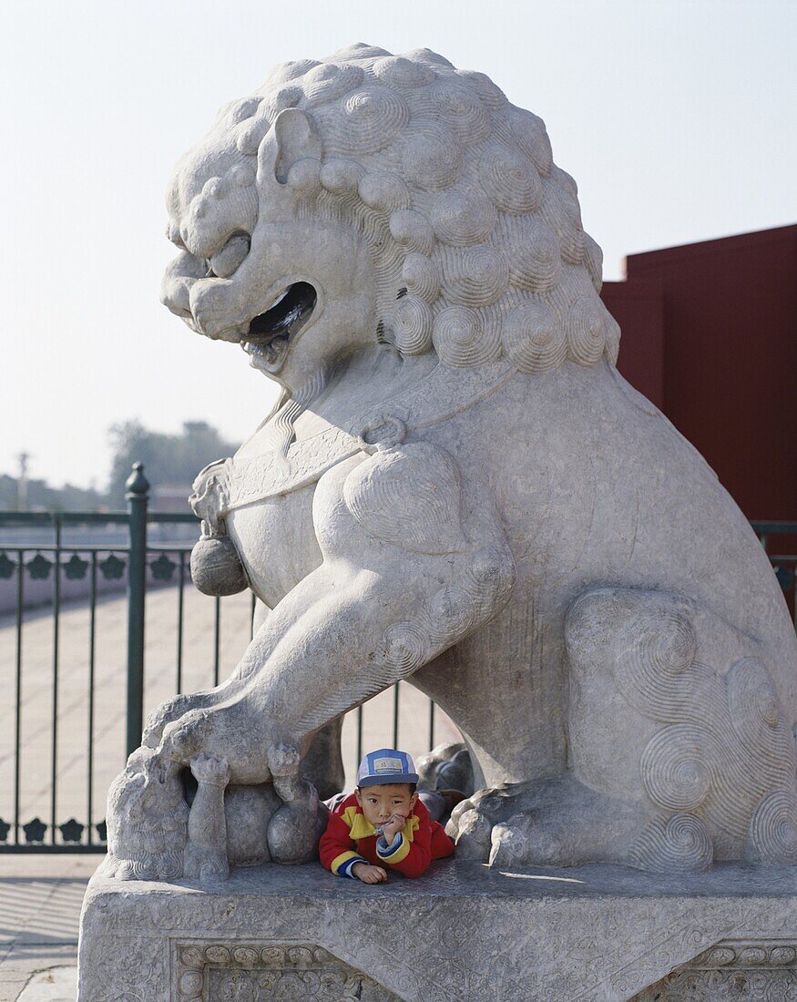 Beijing, Boy resting on Stone Lion, Statue, China, . Asia, Beijing, Peking, Boy, China, Holiday, Landmark, Lion, Resting, Statue, Stone, Tiananmen square, Tourism, Travel, Vacation