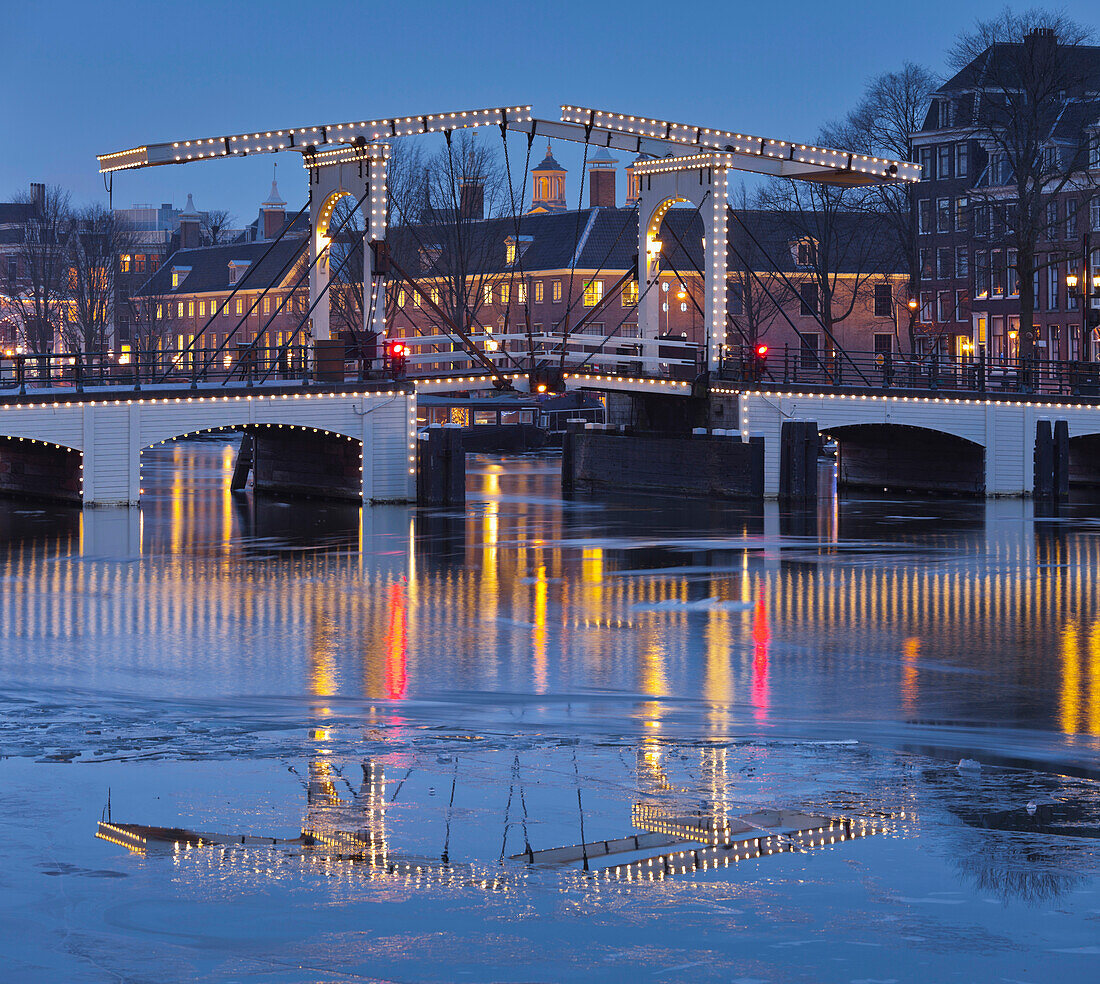 Magere Brug over the river Amstel at dusk, Amsterdam, North Holland, Netherlands