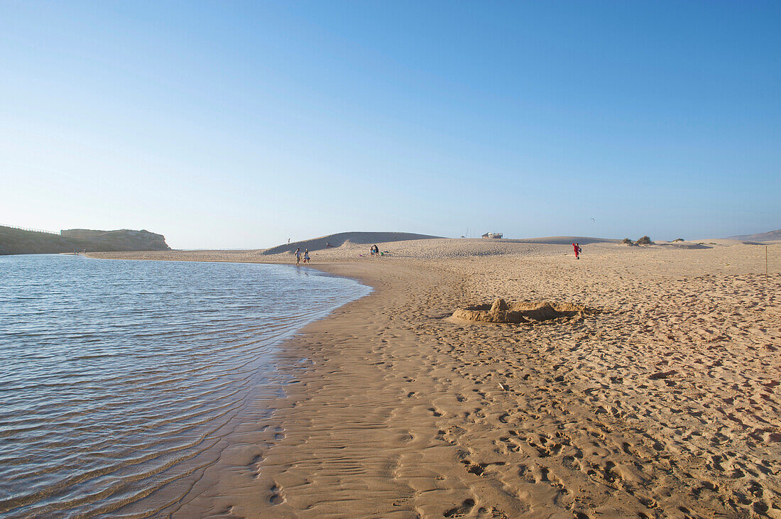 Wide sand beach at the Praia de Bordeira, soft evening light, west coast of Algarve, Costa Vicentina, Algarve, Portugal, Europe