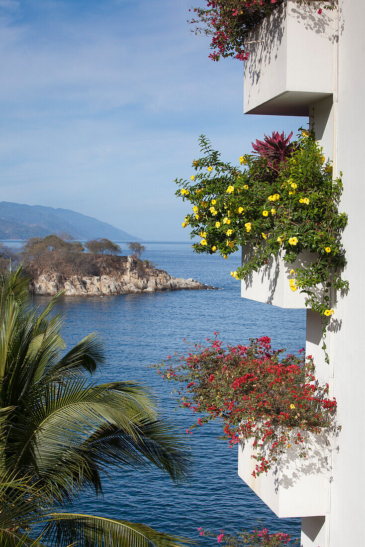 Tropoical flowers on balconies of high-rise building at Mismaloya, near Puerto Vallarta, Jalisco, Mexico, Central America