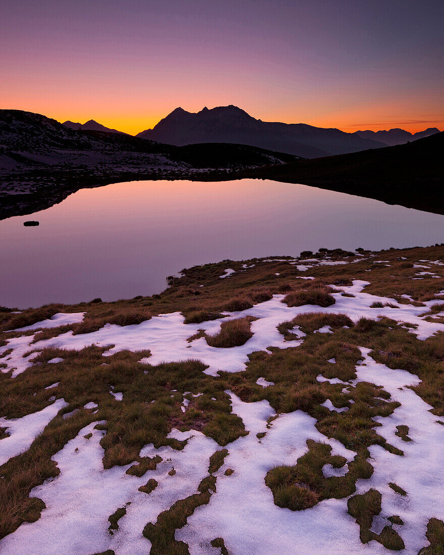 Patches of old snow on the shore of lake Salfains See, Evening light, Rosskogel, Tyrol, Austria