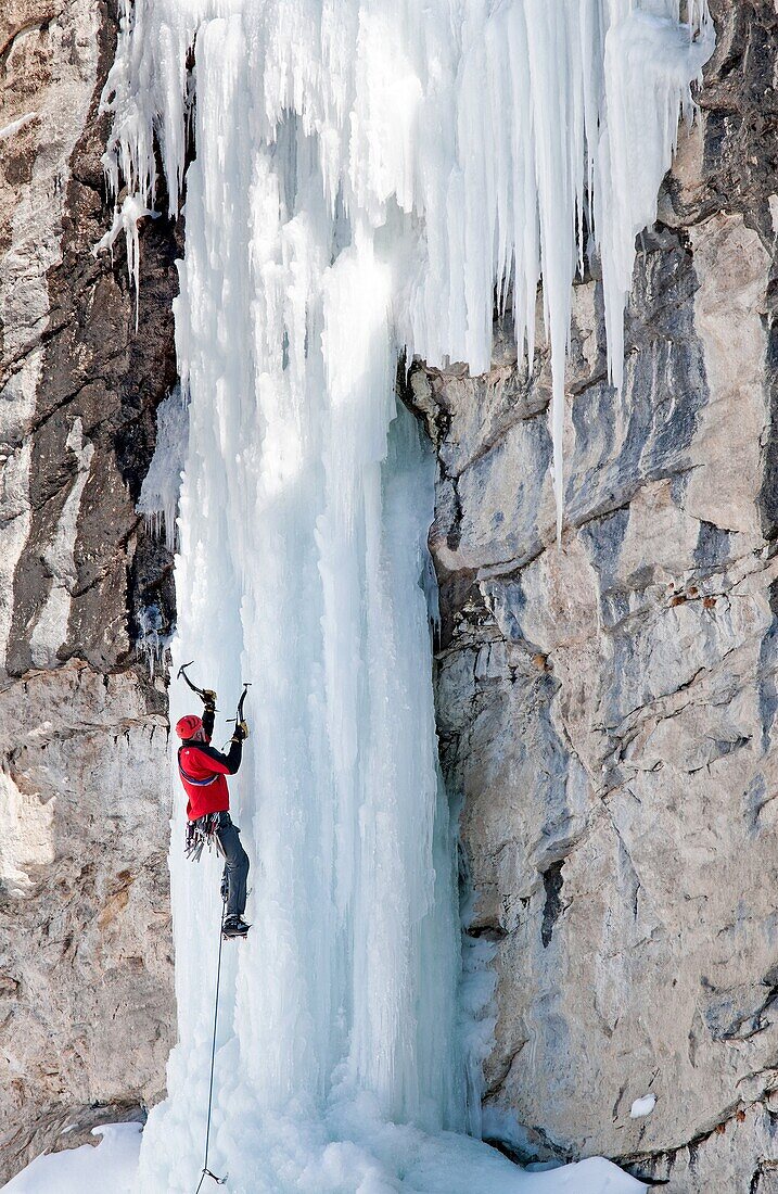 Man ice climbing a route called The Boy Scout which is rated WI, 4 and located in Lamoille Canyon at The Ruby Mountains in northeastern Nevada