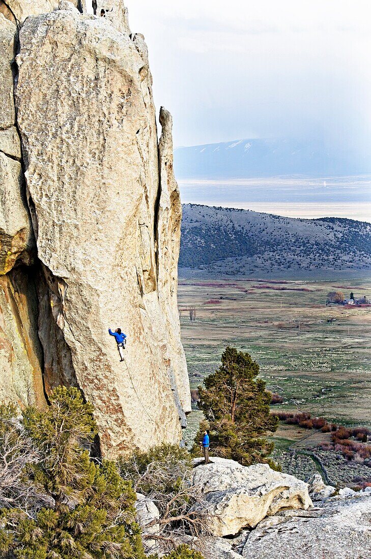 Rock climbing a route called Sancho Rama which is rated 5, 10 and located on the Upper Comp Wall at Castle Rocks State Park near the town of Almo in southern Idaho