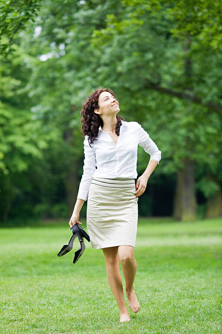 Businesswoman relaxing in a park