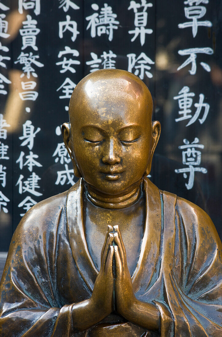 A detailed view reveals the beautiful bronze sculpturing of a Nadebotoke (Rubbing Buddha) Jizo statue, which worshippers may rub for good health, at Sensoji Temple (also known as Asakusa Kannon Temple) in Asakusa, located in the old shitamachi downt [...]