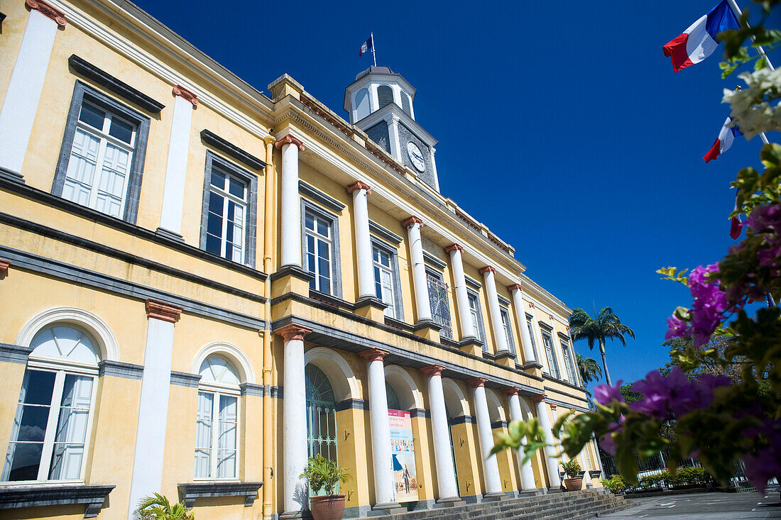 Town hall and bougainvillea flowers, St Denis, Reunion Island, Indian Ocean, France