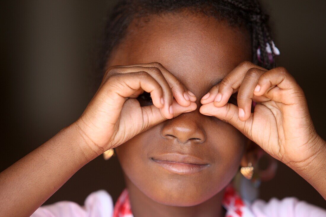 African girl playing with her fingers. Bamako. Mali. (Bamako, Mali)