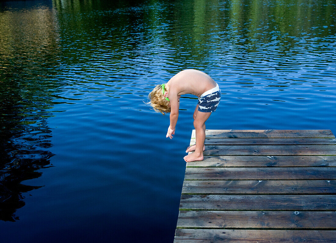 boy by lake