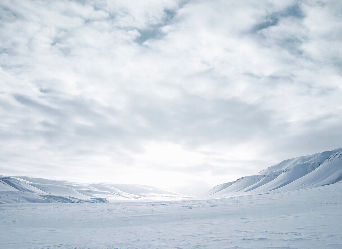 Mountains and snow_covered field. Mountains and snow_covered field